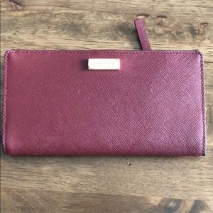 Maroon used Kate spade wallet.